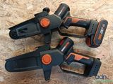 three black and orange corded tools on top of a piece of plywood