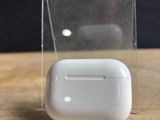 an apple airpods are sitting in a clear box on a wooden table