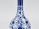 blue and white vase with floral design on the bottom