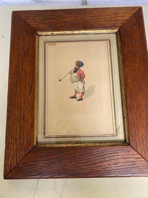 an image of a picture of a man playing golf in a wood frame