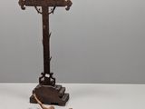 an old wooden crucifix with a cross and a crucifix on the ground