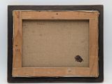 an old picture frame with a small bug on it