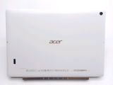 the back of a white laptop computer sitting on top of a white table