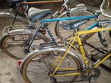 two bicycles parked next to each other in a garage