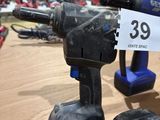 a cordless drill on a table with a price tag on it