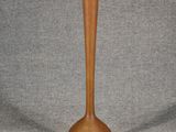 a small wooden vase that is sitting on a table