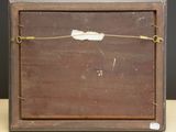 a small wooden box with a piece of paper on it