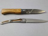 two knives that are sitting next to each other on a table