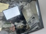 a man taking a picture of himself in the mirror