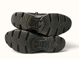 two pairs of shoes that are sitting on top of each other