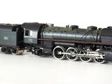 a toy train on a white surface with a white background