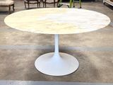 a white table with a marble top in a room