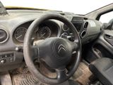 dashboard of a car with a steering wheel and dashboard gauges