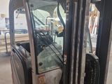 a forklift that is parked in a warehouse
