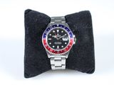 a watch that is sitting on top of a pillow