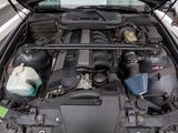 a car with its hood open and the engine in it