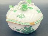an image of a green and white bowl on a table