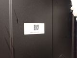 a qr code on the door of a bathroom stall