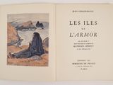 a book with a picture of a woman sitting on the beach