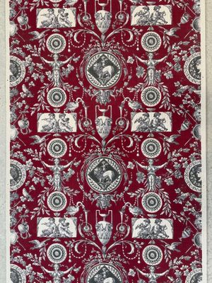 un gros plan sur un papier peint rouge et blanc à motifs