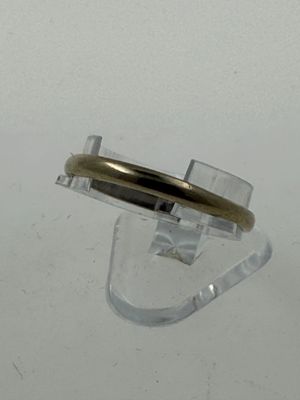 a ring that has a gold band on top of it