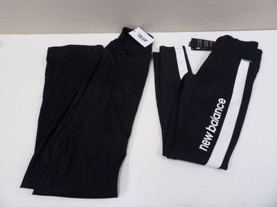 a pair of black pants with white and black logos on them
