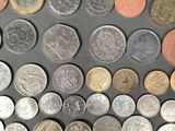 a lot of coins that are on the table