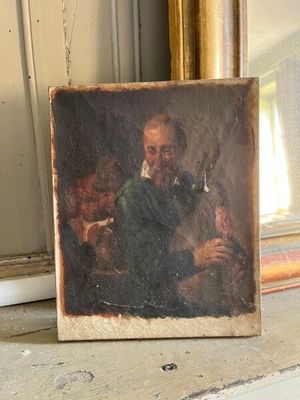 une photo d'un tableau représentant un homme et un chien sur le rebord d'une fenêtre