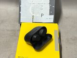 an image of a box with a pair of black earphones in it