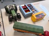 many toy cars and trucks sitting on a table