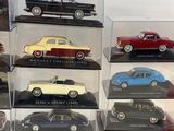 a lot of different models of cars in a display case