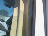 a white truck that has a bunch of items in the back