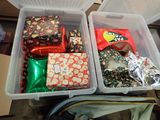 two plastic containers filled with different types of gifts