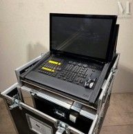 a laptop computer sitting on top of a flight case