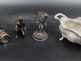 several antique silverware items including a bowl, pair of binoculars, and a pair of binoculars