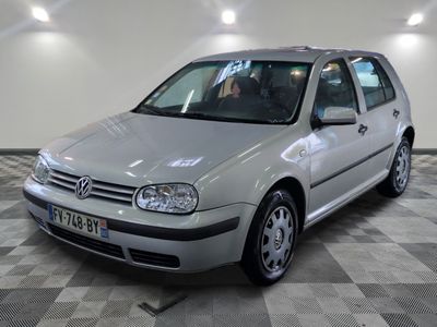 a silver car that is parked on a checkered floor
