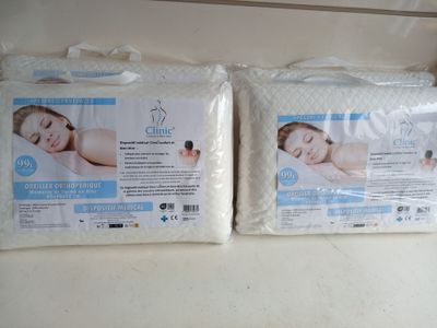 two pillows that are sitting on top of each other