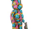 the bear is standing next to a small toy bear on a white background