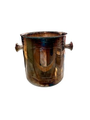 a metal ice bucket with a handle on a white background