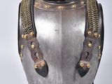 an old helmet with a chain around the neck and a chain around the neck