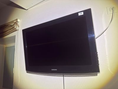a flat screen tv mounted on a wall in a room