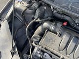 a car engine with its hood open on the street