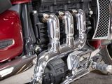 a close up of a motorcycle engine on a street