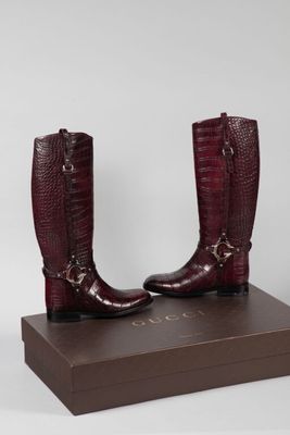 GUCCI (Made in Italy). Paire de bottes cavalières en cuir bo…