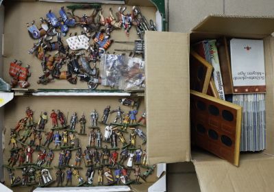 a box full of toy soldiers and a box full of other toys