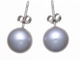 pair of silver pearl earrings on a white background