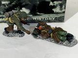 two figurines of soldiers with gas masks on their heads