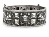 a close up of a silver bracelet on a white background