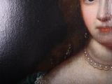 painting of a woman in a green dress with pearls and a pearl necklace