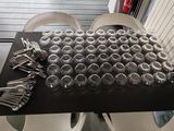a table with a lot of glasses and silverware on it